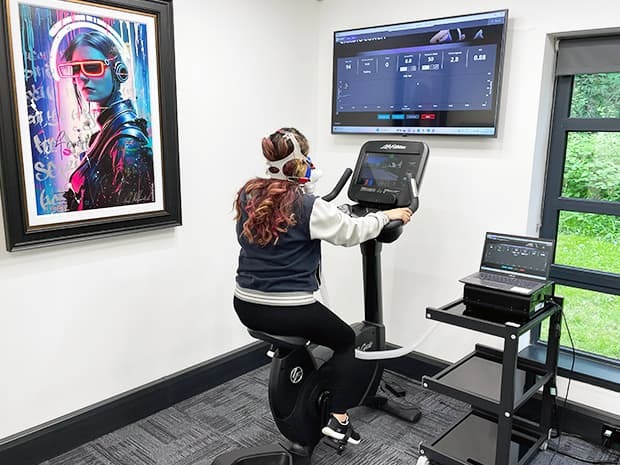 A customer running on a treadmill during a vo2 max test