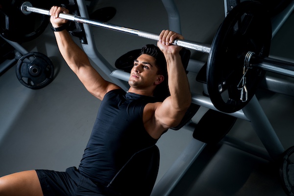 Man doing bench press with light weight